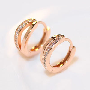 Delicate rose gold hoop earrings with pave cubic zirconia details