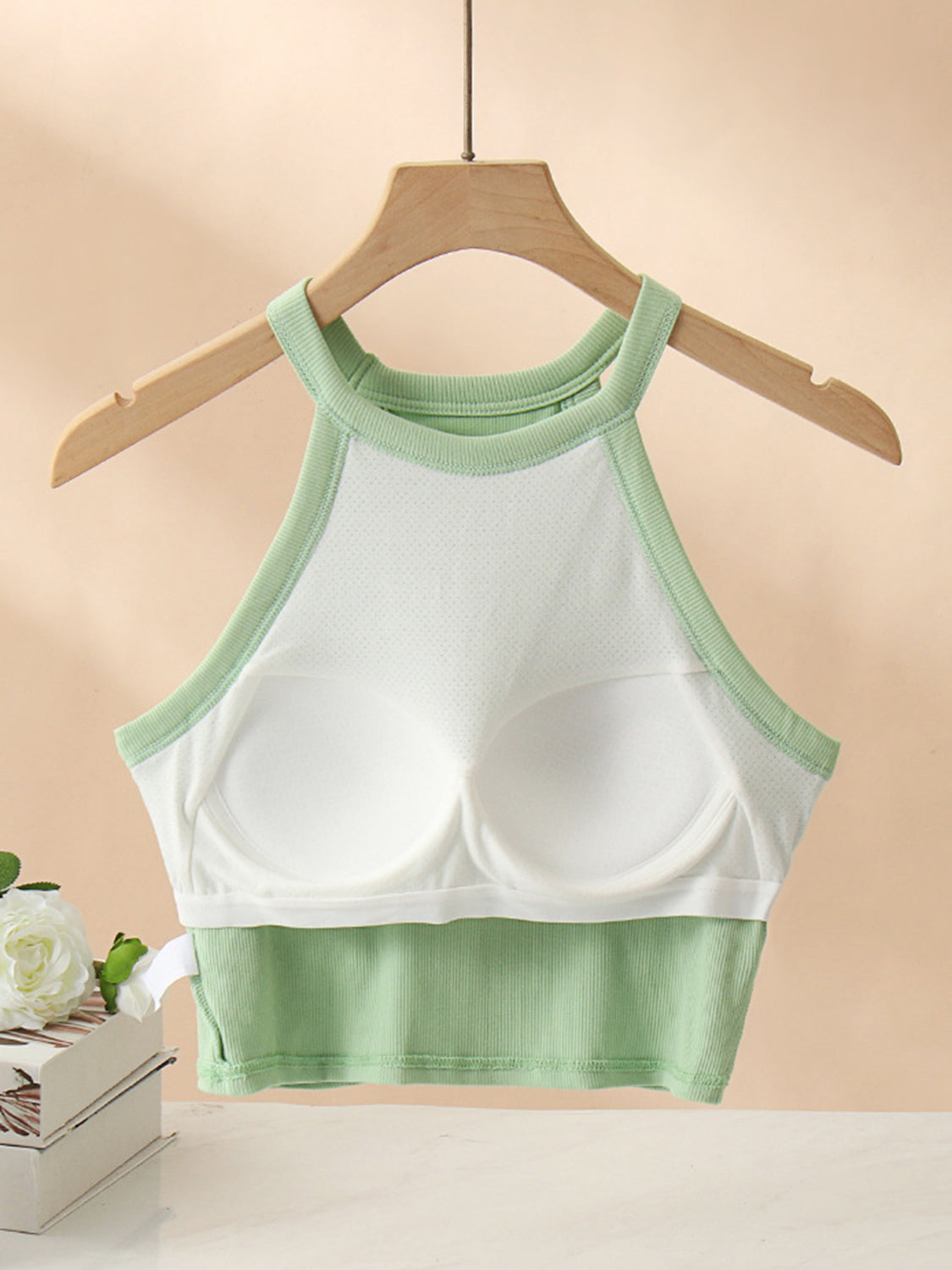 Ribbed halter crop top in Gum Leaf with contrast stitching and built-in bra cups.