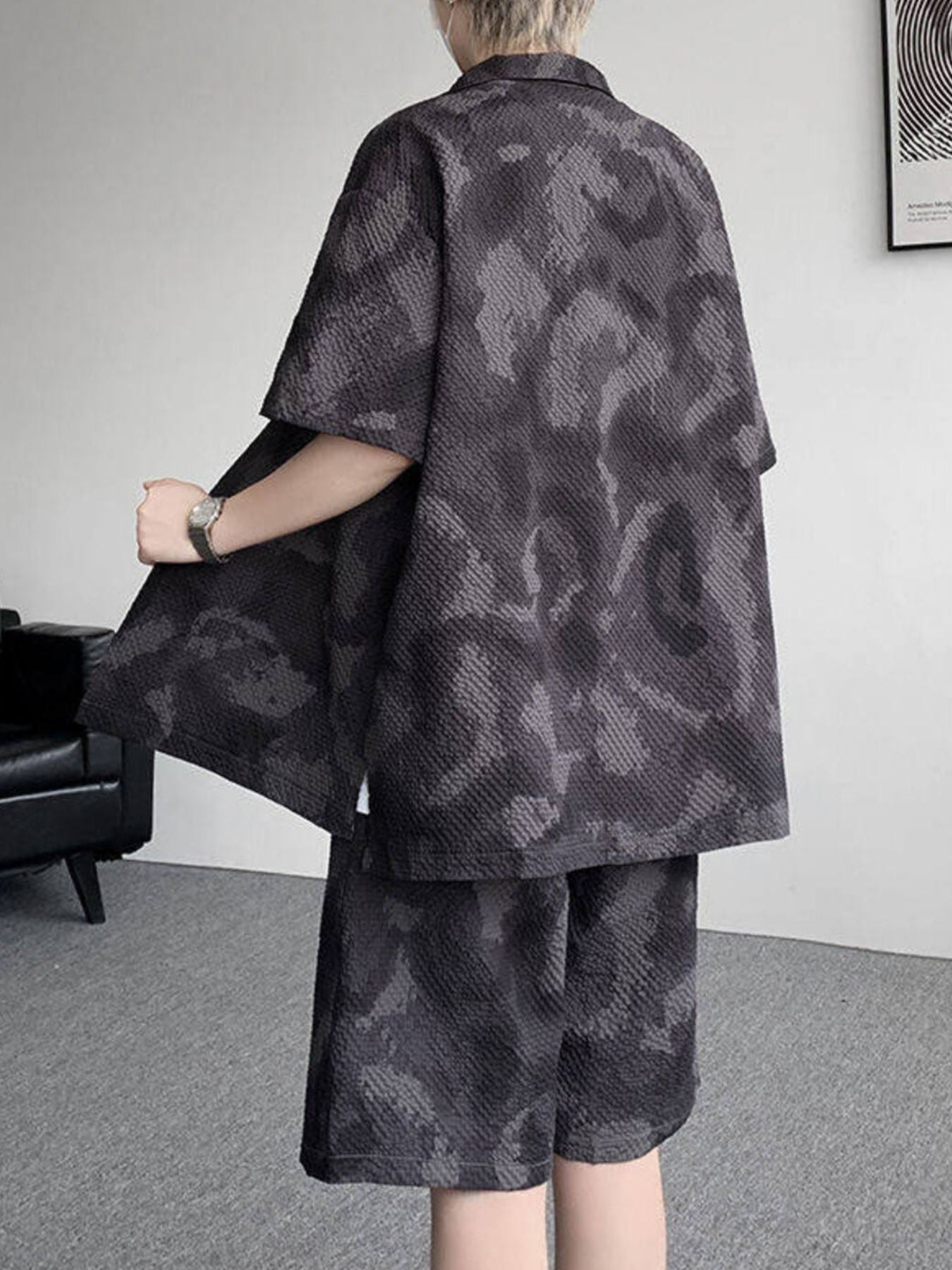 Men's dark gray camouflage print short sleeve shirt and shorts set.