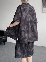 Men's dark gray camouflage print short sleeve shirt and shorts set.