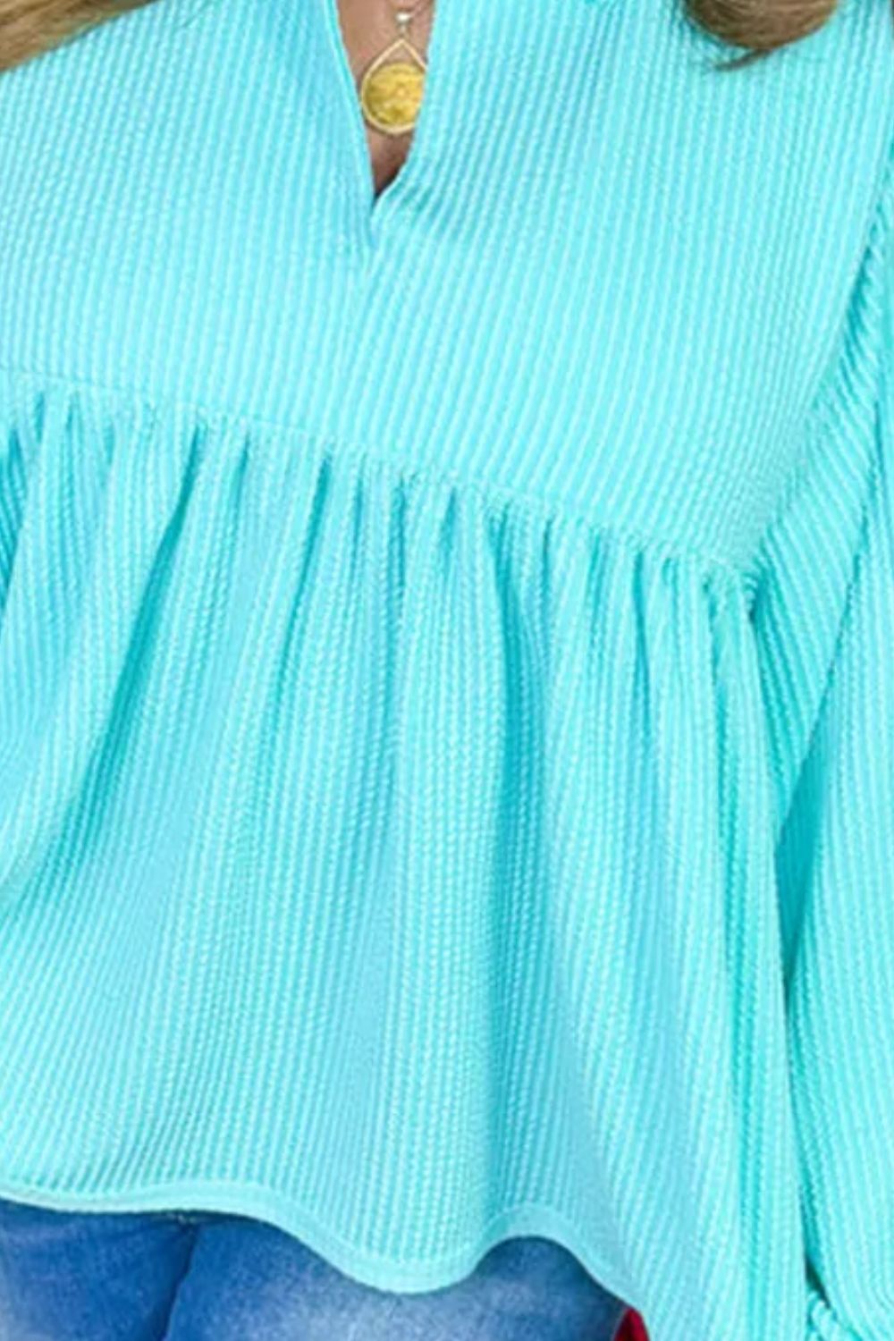 Mint blue textured babydoll blouse with pointed collar and smocked bodice