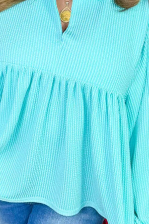 Mint blue textured babydoll blouse with pointed collar and smocked bodice