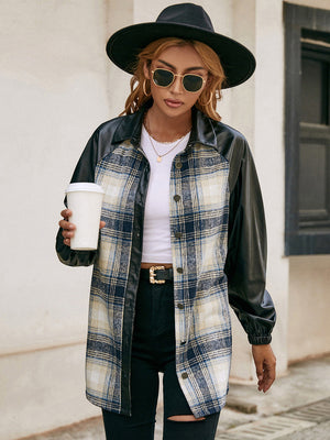 Plaid & faux leather raglan shacket with buttoned front and black sleeves.