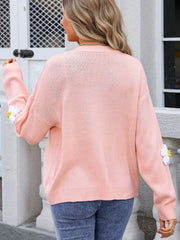 Pink acrylic V-neck cardigan with daisy appliqué on sleeves
