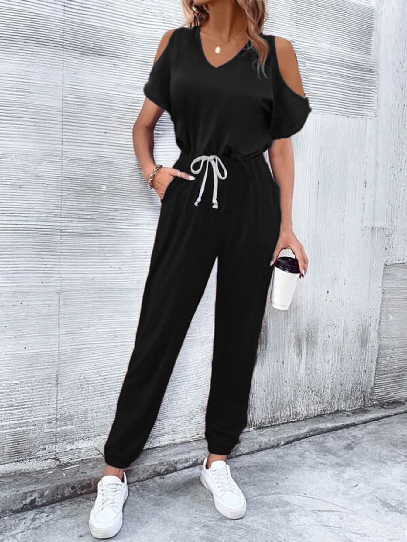 Black cold-shoulder jumpsuit with drawstring waist and cuffed ankles
