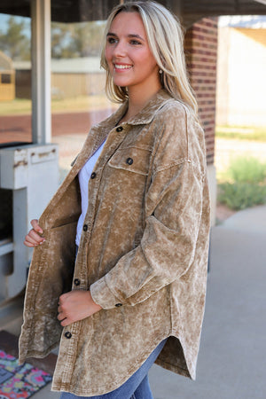 Textured corduroy overshirt in camel with faded wash, button front and chest pockets.