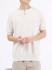Men's short sleeve knit henley t-shirt in off-white with waffle texture and button placket.