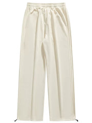 Lightweight beige men's sweatpants with wide legs and drawstring ankles.