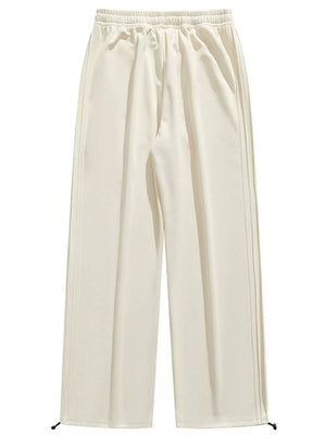 Lightweight beige men's sweatpants with wide legs and drawstring ankles.