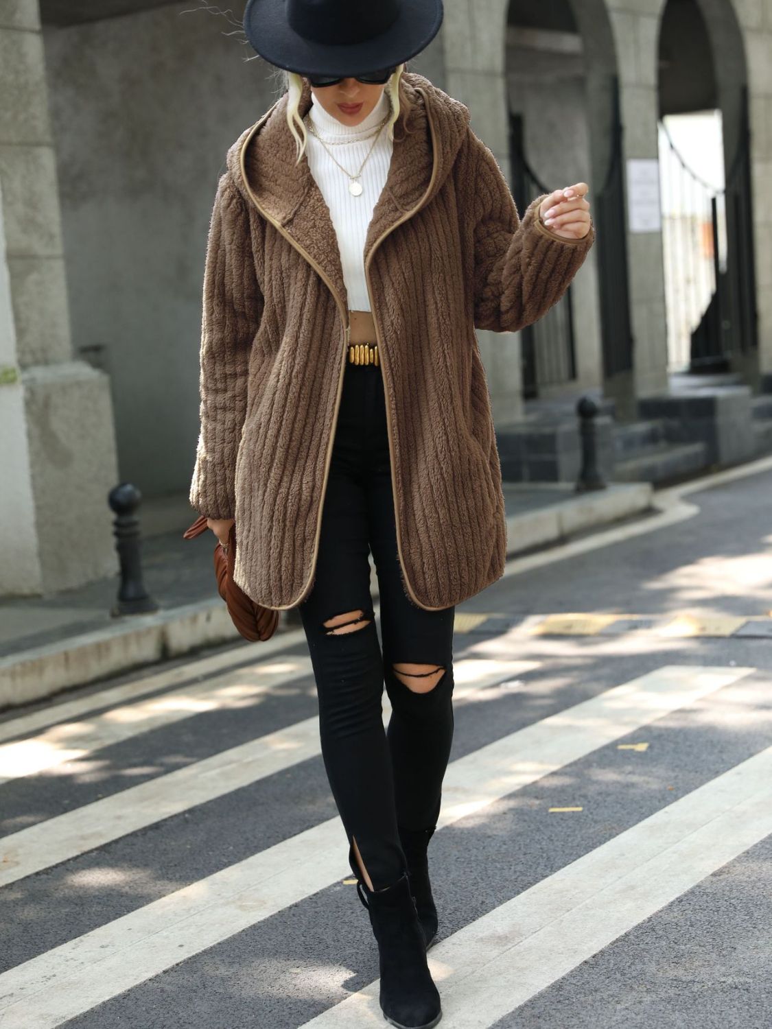 Textured teddy hooded open coat in sand with contrast trim, open front, and a cozy feel.