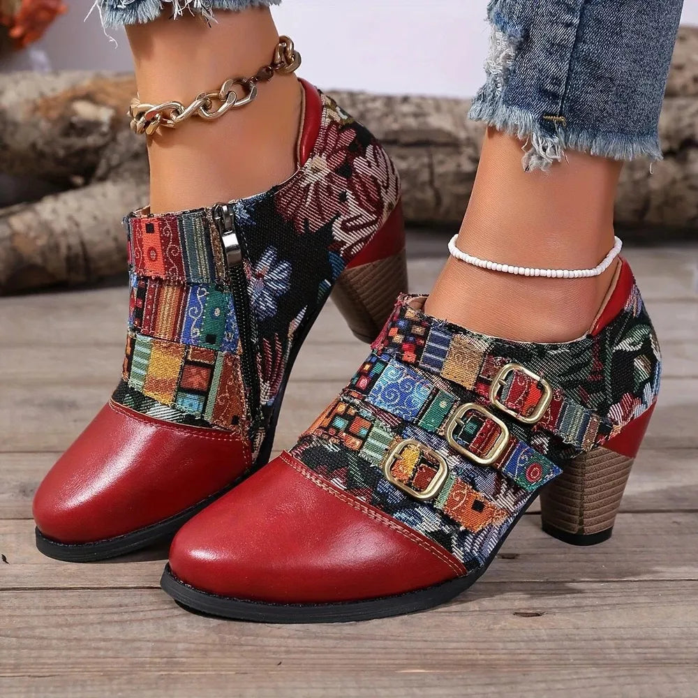 Red ankle boots with patchwork floral fabric, side zipper, and buckle straps.