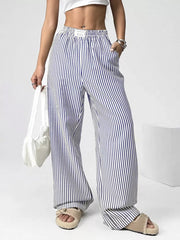Navy striped high-waisted wide-leg pants with drawstring detail and pockets.