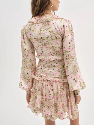 Charming ruffled floral mini dress with ruched waist and bell sleeves.