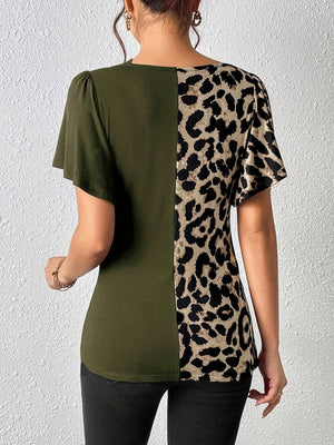 Moss green asymmetric top with leopard print panel and short sleeves.