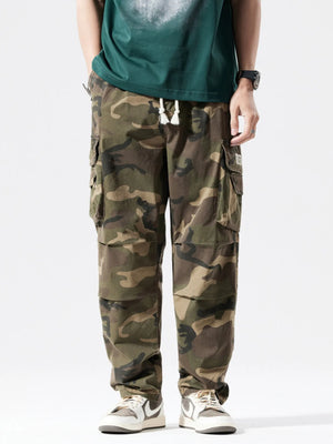 Casual cargo pants in camouflage pattern with drawstring waist and multiple pockets.