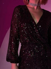 Sequin wrap romper in dark red with blouson sleeves and V-neckline.