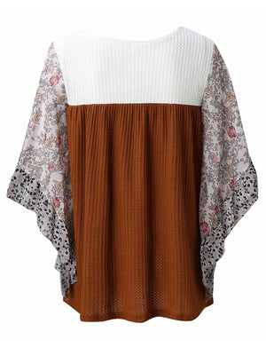 Textured panel blouse with flutter sleeves, white waffle knit top, brown ribbed body, and floral print sleeves.