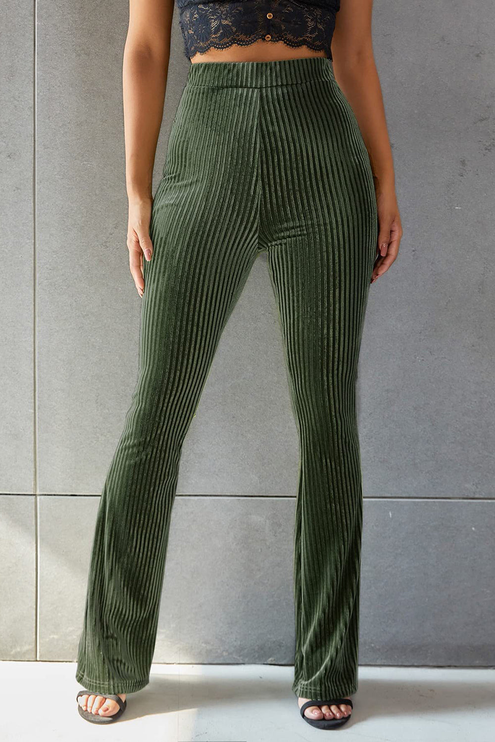 Ribbed velvet palazzo trousers in Army Green, featuring a flared leg and high waist.