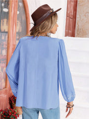 Misty Blue embroidered yoke blouse with gathered bodice and long sleeves.