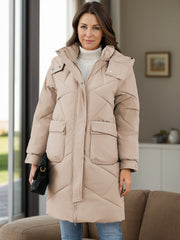 Khaki diamond quilted hooded puffer coat with two front pockets and a zip closure.