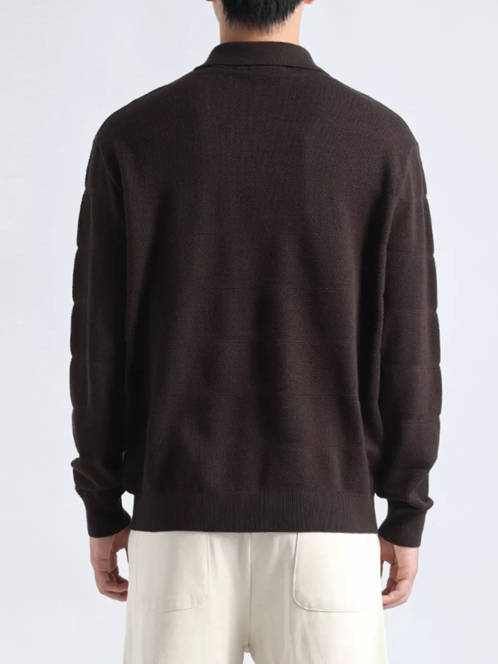 Men's brown knit polo shirt with textured pattern and button accents.