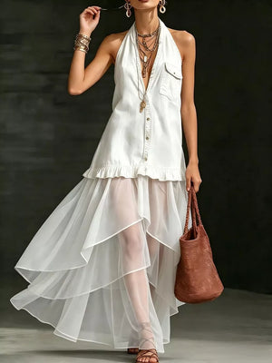 White halter maxi gown with ruffled hem and sheer tiered skirt.
