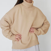 Khaki relaxed roll-neck sweater with boxy knit and ribbed cuffs.