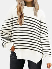 White and black striped knit sweater with slouchy sleeves and ribbed details.