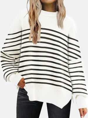 White and black striped knit sweater with slouchy sleeves and ribbed details.