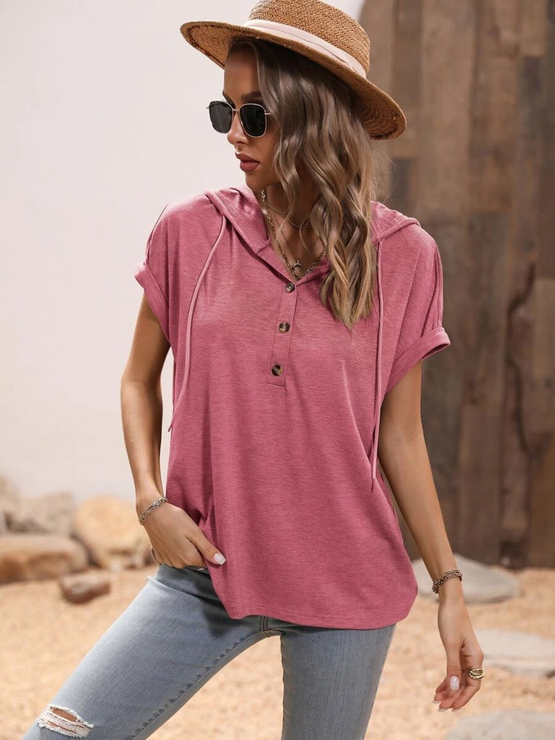 Dusty pink relaxed fit short sleeve henley hoodie with rolled cuffs and button detail