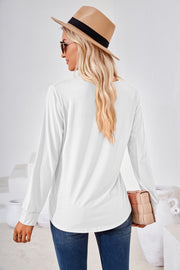 White jersey top with long sleeves and a gathered square neckline.