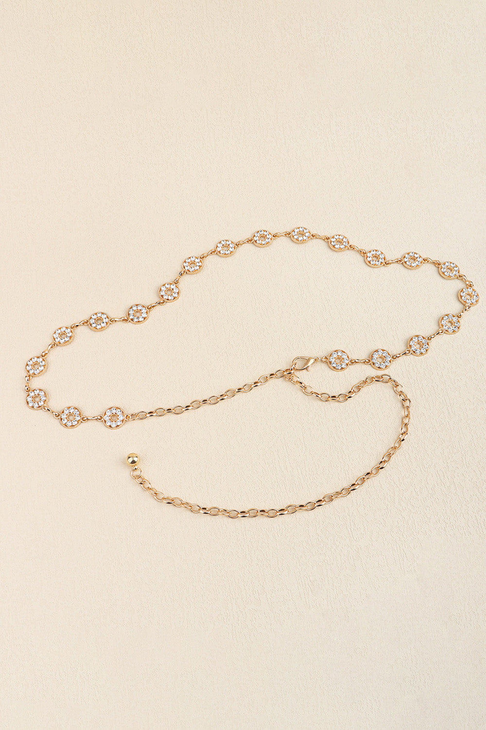 Gold celestial chainmail waist belt with crystal-embellished circular charms and adjustable chain.