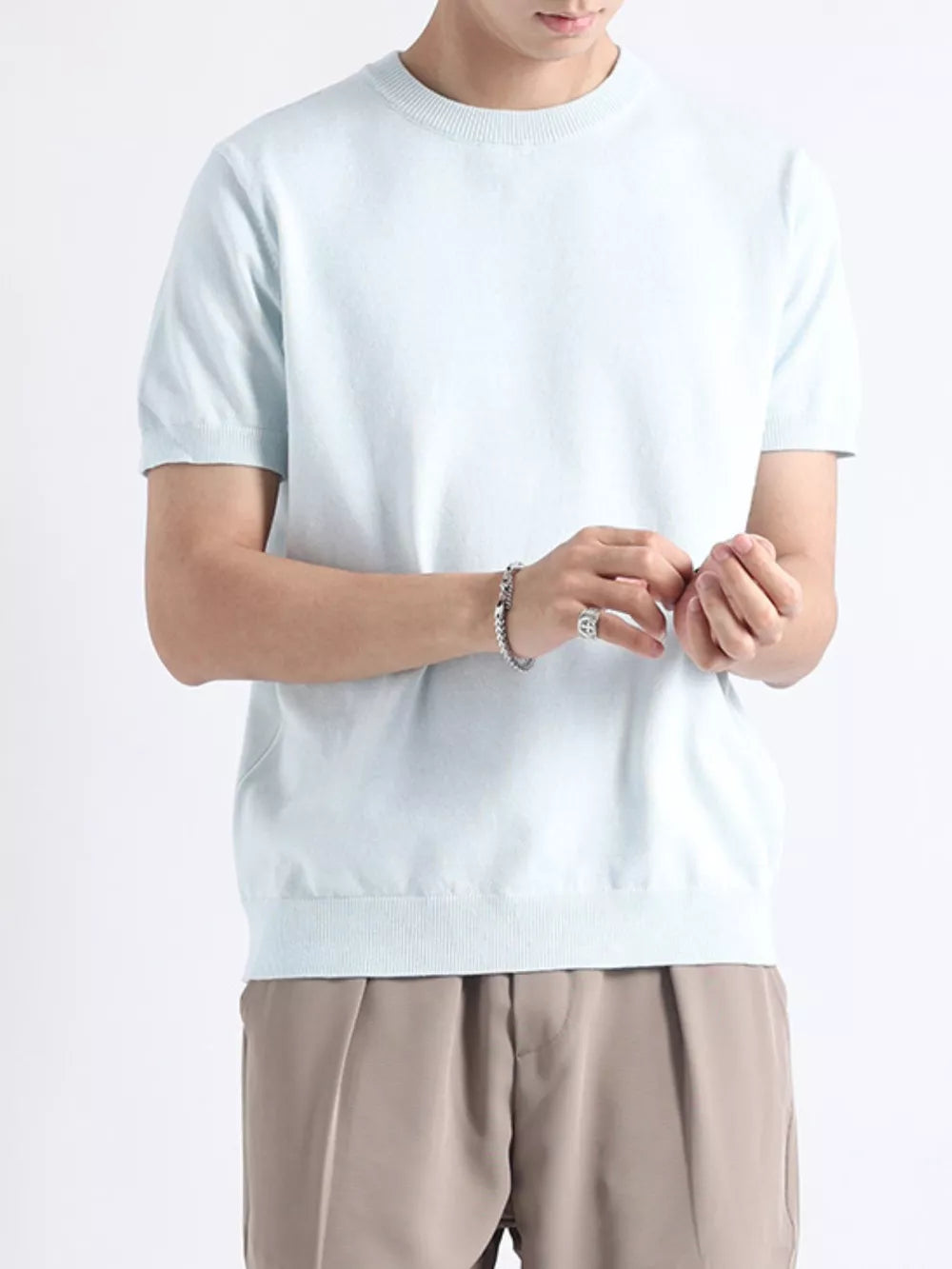 Men's light blue knitted t-shirt with short sleeves and crew neck.