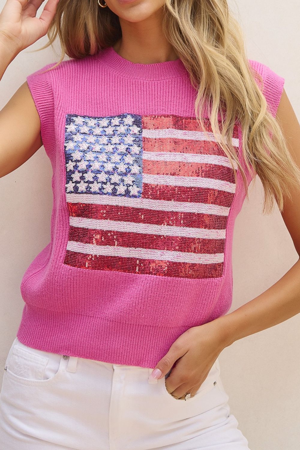 Fuchsia pink knit tank top with sequin American flag detail and crew neck.