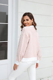 Dusty Pink checkerboard sleeve contrast cardigan with striped sleeves and white trim.