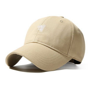 Beige baseball cap with curved brim and white embroidered logo detail.