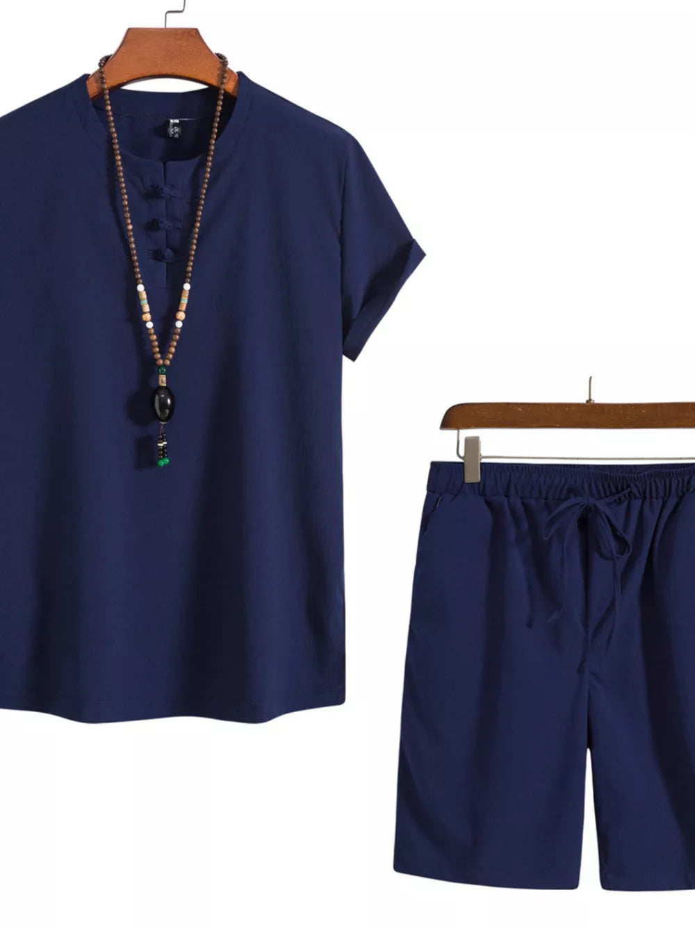 Navy blue men's casual set with mandarin collar shirt and drawstring shorts.
