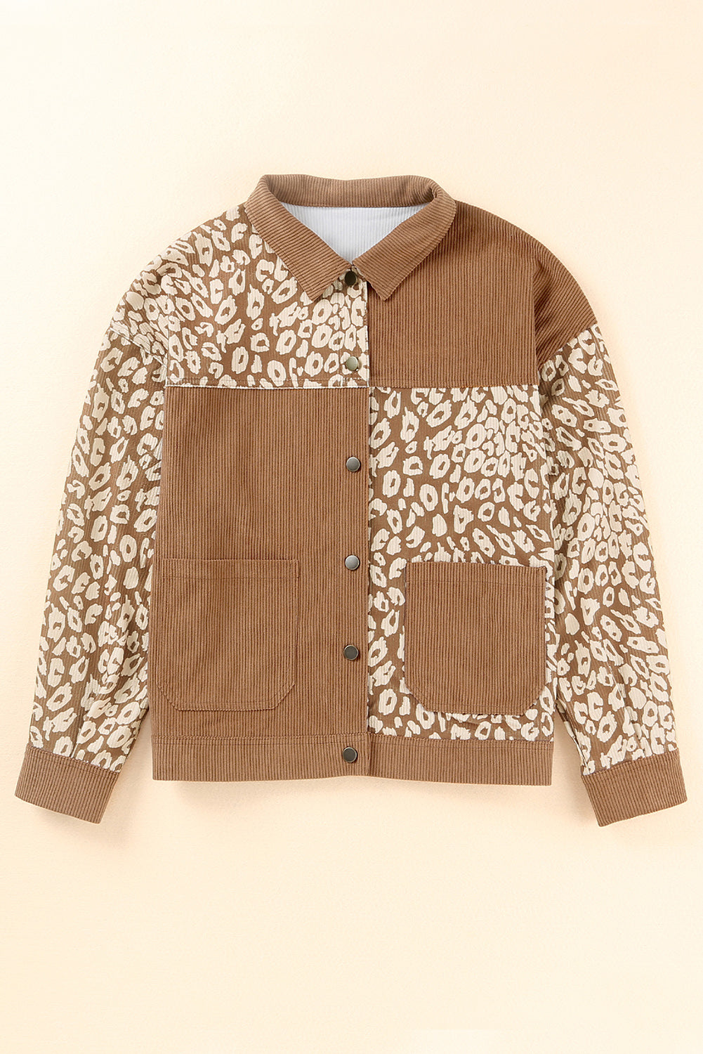 Corduroy jacket in camel with leopard print panels, button front, and chest pockets.