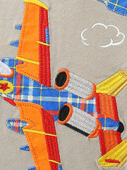 Toddler t-shirt with embroidered airplane applique featuring plaid wings and orange accents.