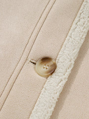 Lined western jacket in eggshell with a button closure and sherpa trim detail.