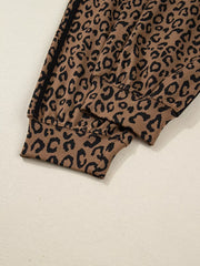 Leopard print joggers with drawstring detail and cuffed hem.