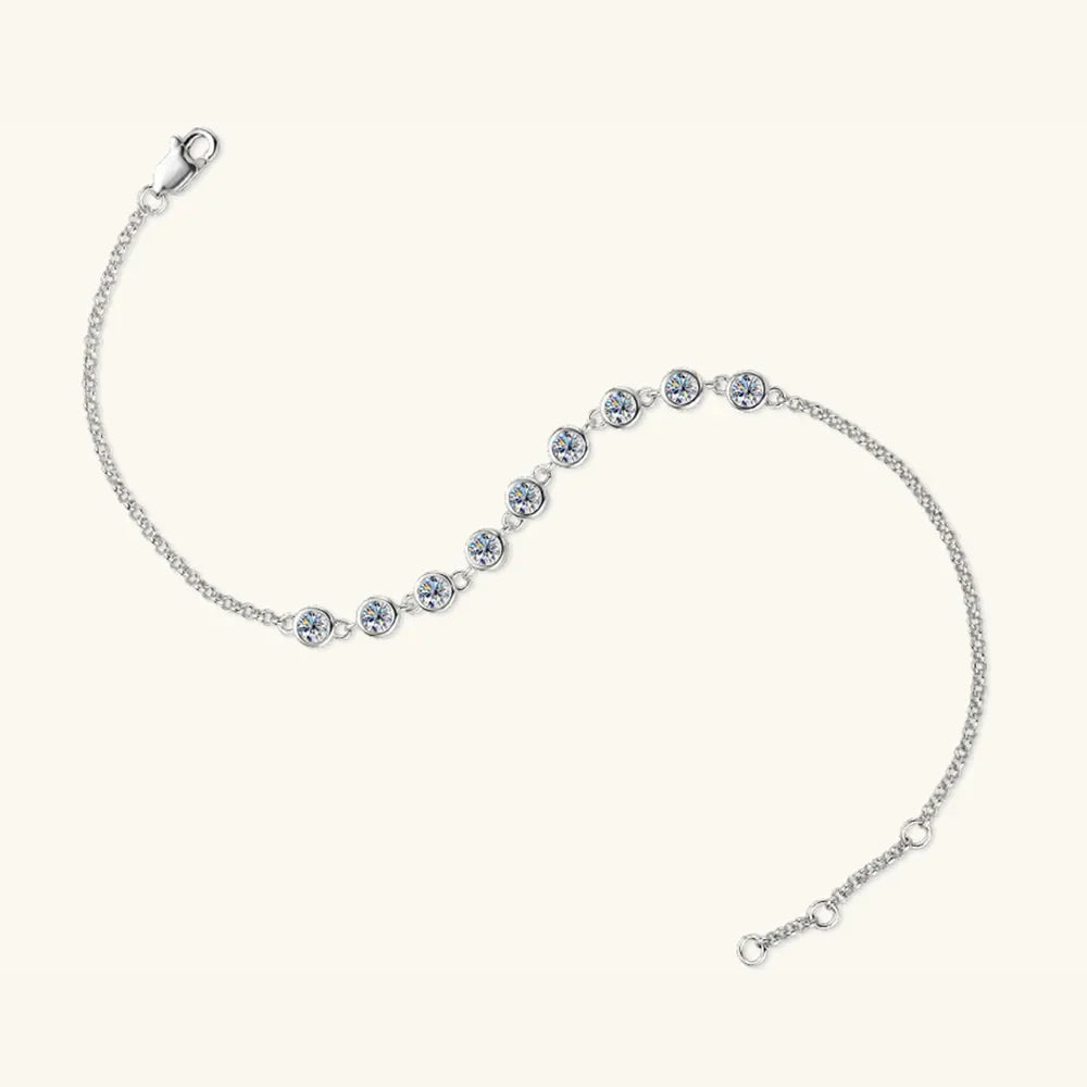 Silver bezel-set moissanite tennis bracelet with adjustable clasp