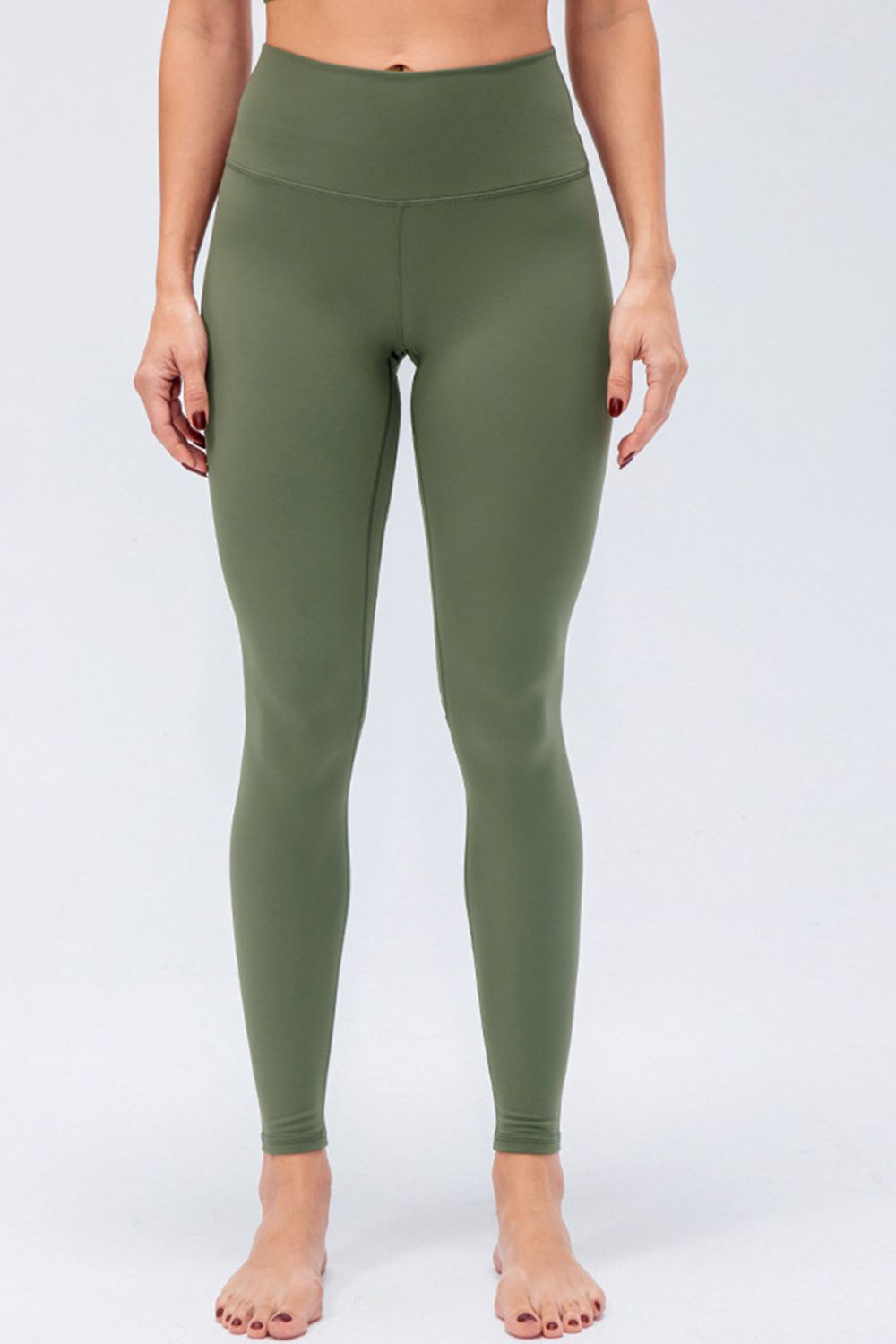 Sculpted Olive High-Rise Performance Leggings with a seamless waistband and full length.