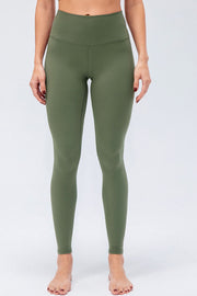 Sculpted Olive High-Rise Performance Leggings with a seamless waistband and full length.