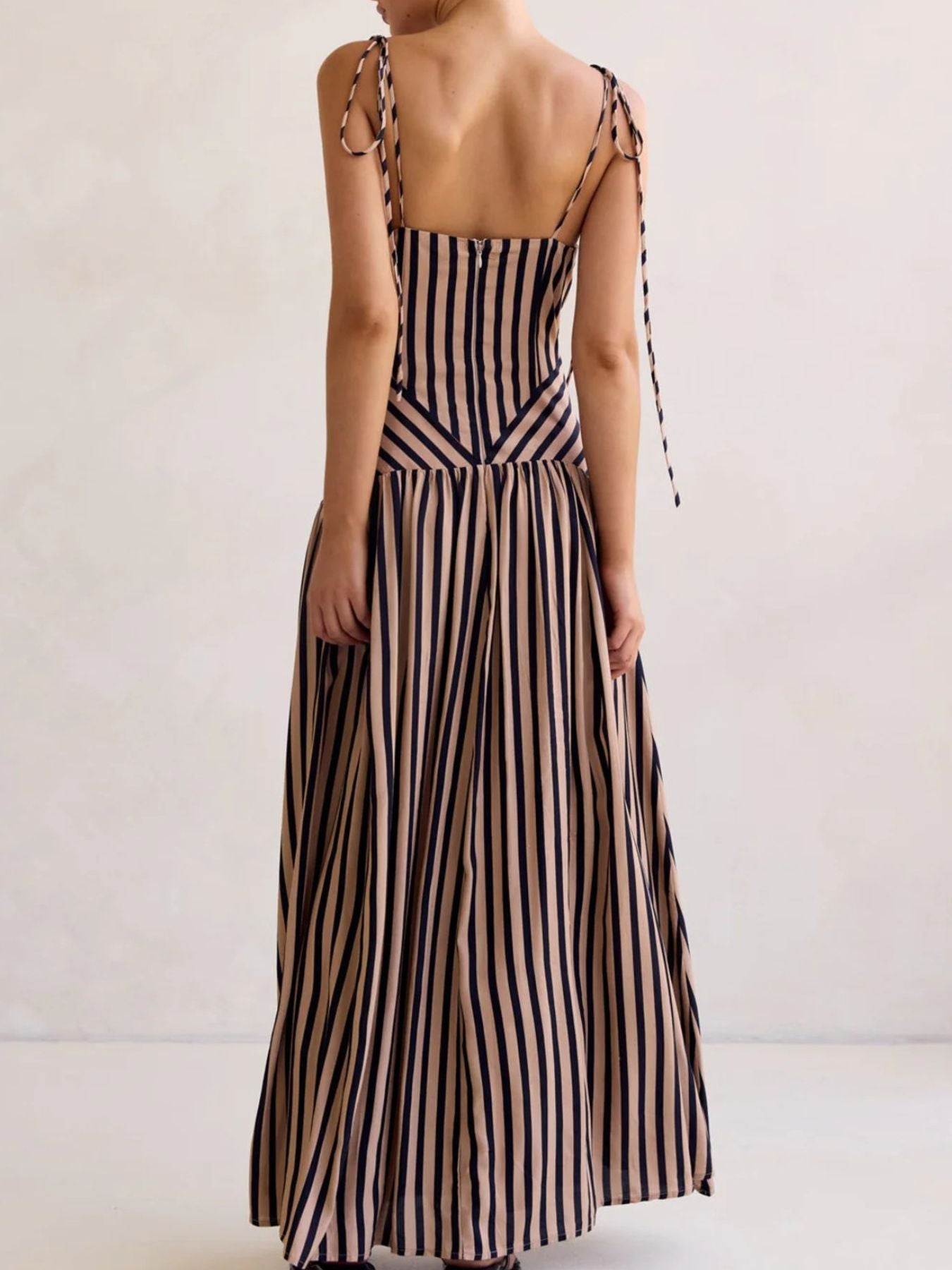 Brown and navy striped maxi dress with tie shoulder straps and V-neck.