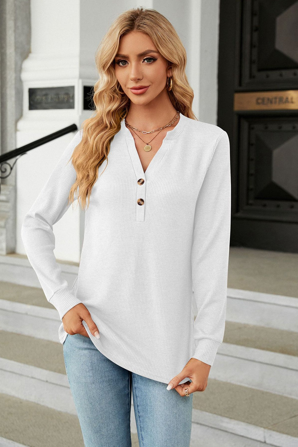 White waffle knit long sleeve top with button detail and v-neck