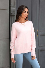 Blush pink brushed-knit crewneck pullover sweater with long sleeves.