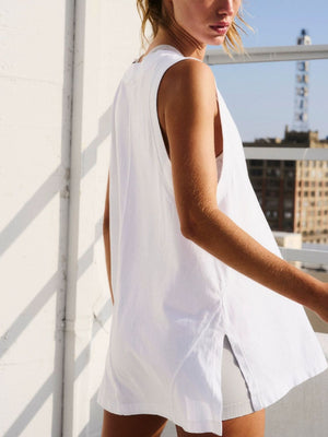 White wrap-front pocket tank top with side slits and a relaxed fit.
