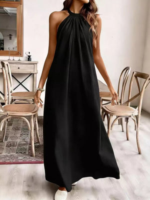 Black ruched halter maxi gown with a flowing A-line skirt.