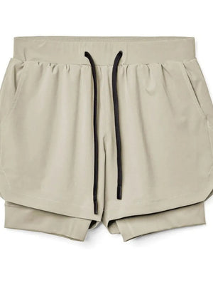 Khaki layered performance shorts with black drawstring and perforated panels